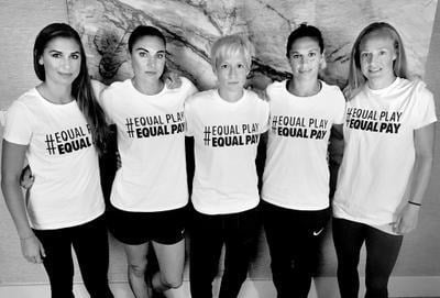Five members of the U.S. Women's National Team in Equal Play T-shirts, in black and white